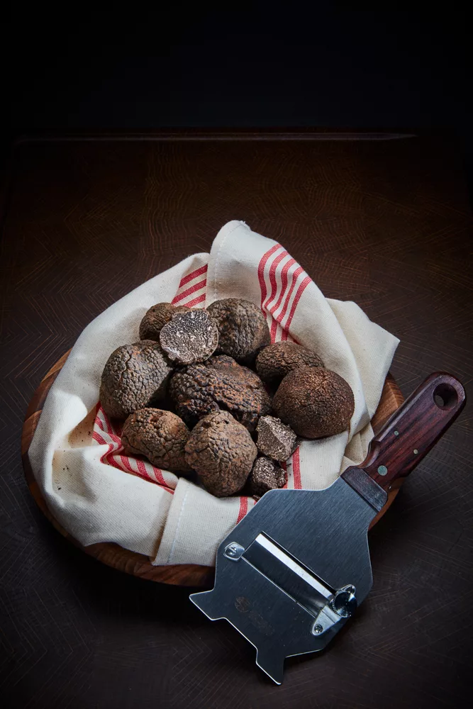 Black truffles from Italy in a linen lined basket